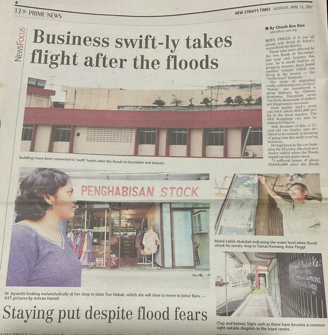 New Straits Times page from April 2007 on the Kota Tinggi floods, showing her outside her shop beneath a clearance sale sign.